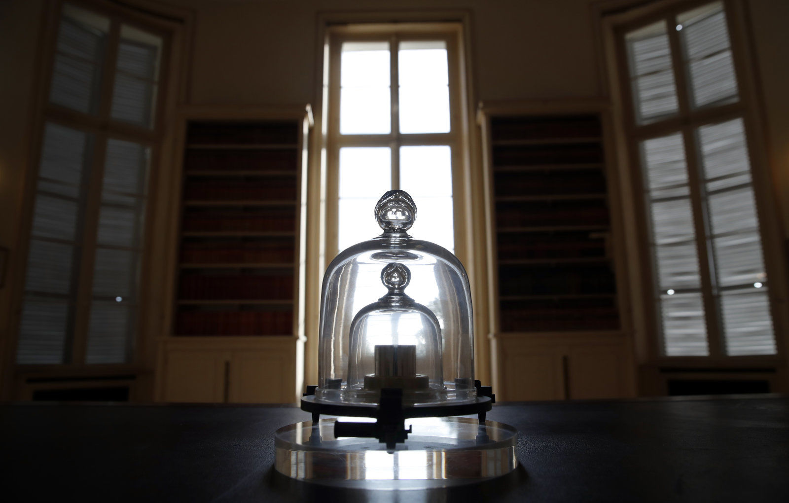 In this photo taken Wednesday, Oct. 17, 2018., a replica of the International
Prototype Kilogram is pictured at the International Bureau of Weights and
Measures, in Sevres, near Paris. The golf ball-sized metal cylinder at the heart
of the world's system for measuring mass is heading into retirement. Gathering
this week in Versailles, west of Paris, governments on Friday Nov. 16, 2018, are
expected to approve a plan to instead use a scientific formula to define the...